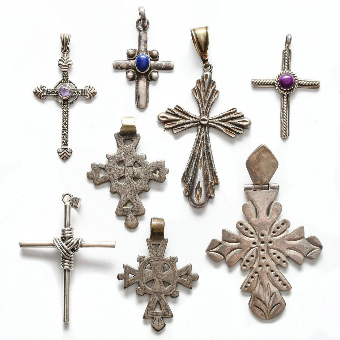 8 STERLING SILVER CHRISTIAN CROSS PENDANTS: 3 w. inset stones. 6/8 stamped 925 or sterling. Total weight is approximately 76.5g. Issued: 20th c. Dimensions: 3"H, tallest Provenance: David Farin Collection
