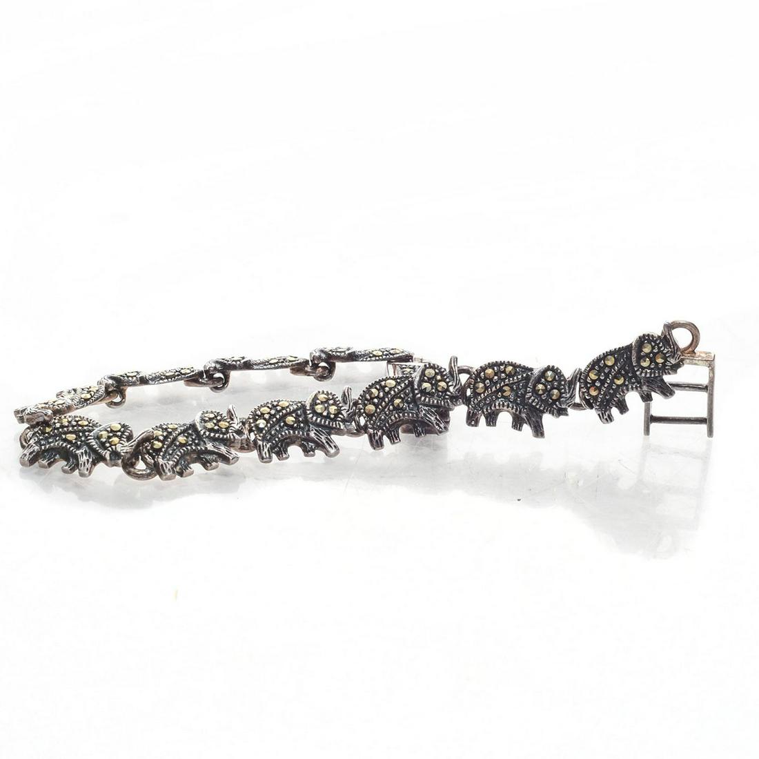 7" SOUTH ASIAN MARKED STERLING ELEPHANT BRACELET: Marching elephants with trunks up. Total Weight 16g. Issued: 20th C. Dimensions: 7"L Provenance: David Farin Collection