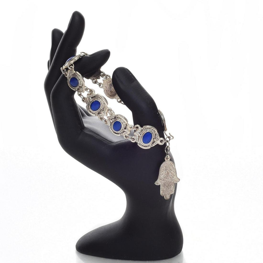 9" HAMSA BRACELET WITH BLUE OPAL STONES: Hand decorated bracelet. Total weight 32g. Issued: 20th C. Dimensions: 9"L Provenance: David Farin Collection