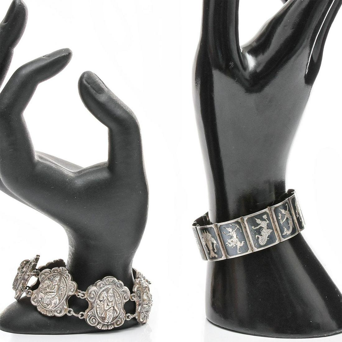 PAIR, STERLING SILVER HINDU GOD BRACELETS: Link bracelets with pantheon of Hindu gods. Total weight is approximately 63.4g. One stamped Made in Siam. Issued: 20th c. Dimensions: 7.5"L Provenance: David Farin Collection