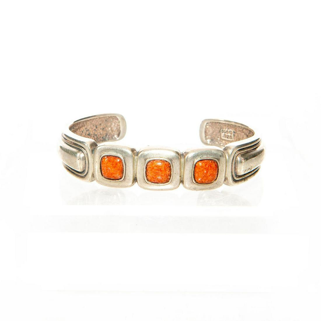 SOUTHWESTERN 925 SILVER WITH CORAL CUFF BRACELET: Three stones, geometric designs. Hallmarked. Approx. weight 35g. Issued: c. 1990 Dimensions: 2.25"D Country of Origin: United States Provenance: David Farin Collection