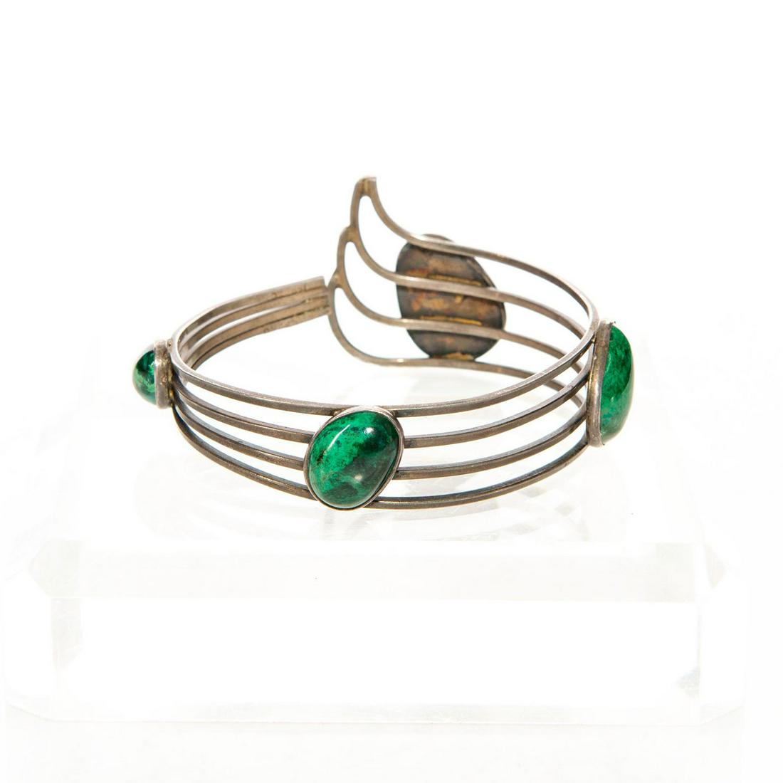 VINTAGE HOLY LAND STERLING SILVER MALACHITE CUFF: Four impressive stones. Hallmarked ISRAEL. Approx. wt. 28 grams. Issued: c. 1960 Dimensions: 2.5"D Country of Origin: Israel Provenance: David Farin Collection