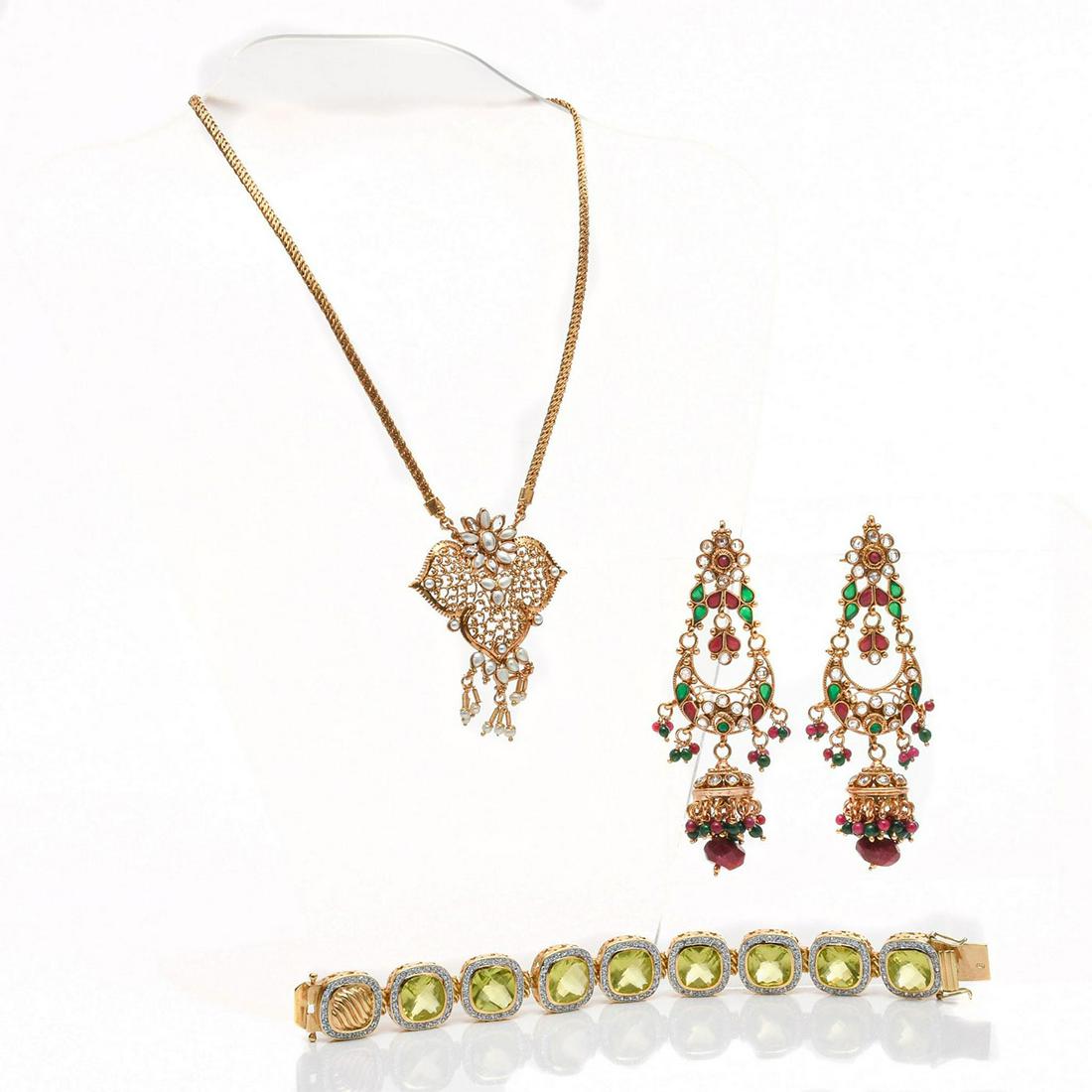 GOLD PLATED EARRINGS, NECKLACE, BRACELET: Heavily adorned with white, green, purple stones. Total weight is approximately 117.6g. Bracelet stamped 925. Issued: 20th c. Dimensions: 16"L, necklace Provenance: David Farin Collection