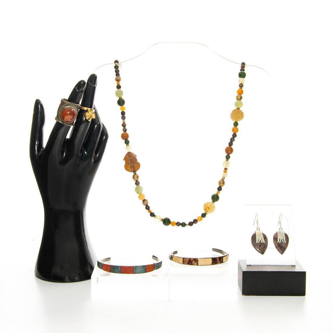 VINTAGE SOUTHERN ASIAN JEWELRY WITH NATURALISTIC STONES: Butterfly Jasper earrings with bracelet and more. Total weight 114g. Necklace size 36"C, Bracelets 7"C and 6.5"C, ring size 6 and 8. Issued: 20th C. Dimensions: 36"C Provenance: David Farin Collection