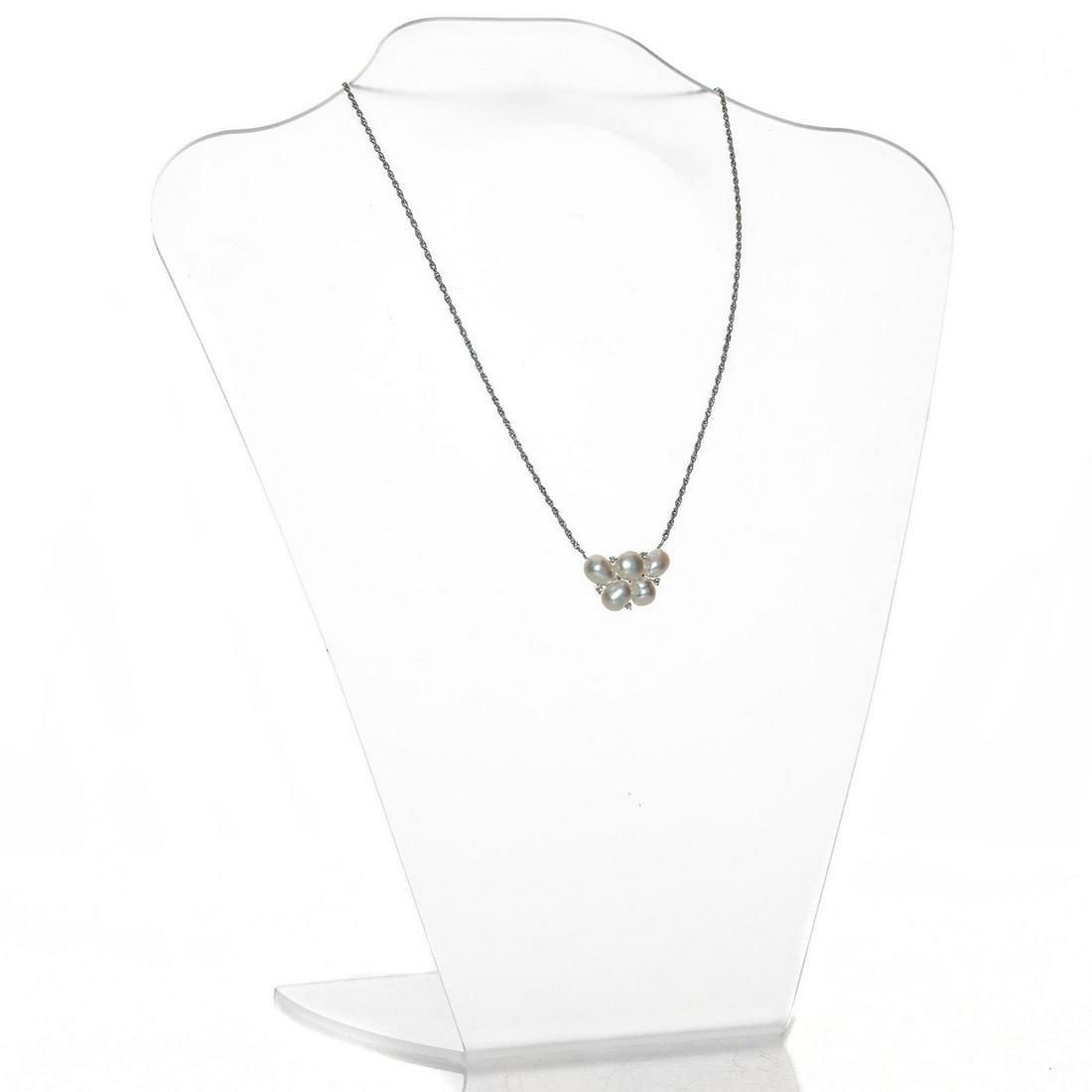 BAROQUE PLATINUM, PEARL & DIAMOND PENDANT NECKLACE: Hallmarked PT 900 pendant, with PT 850 chain and clasp. Issued: c. 1950 Dimensions: .75"H x 1.25"W, pendant Country of Origin: France
