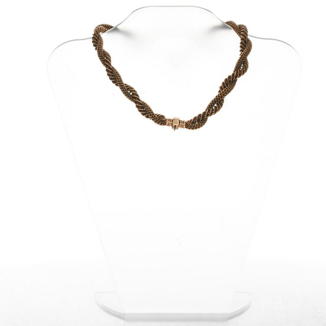 VICTORIAN ANTIQUE HAIR JEWELRY BRAIDED WATCH CHAIN: Exquisite condition and form, with gilt metal floral fobs, chain. Issued: c. 1890 Dimensions: 16.5"L Country of Origin: United States