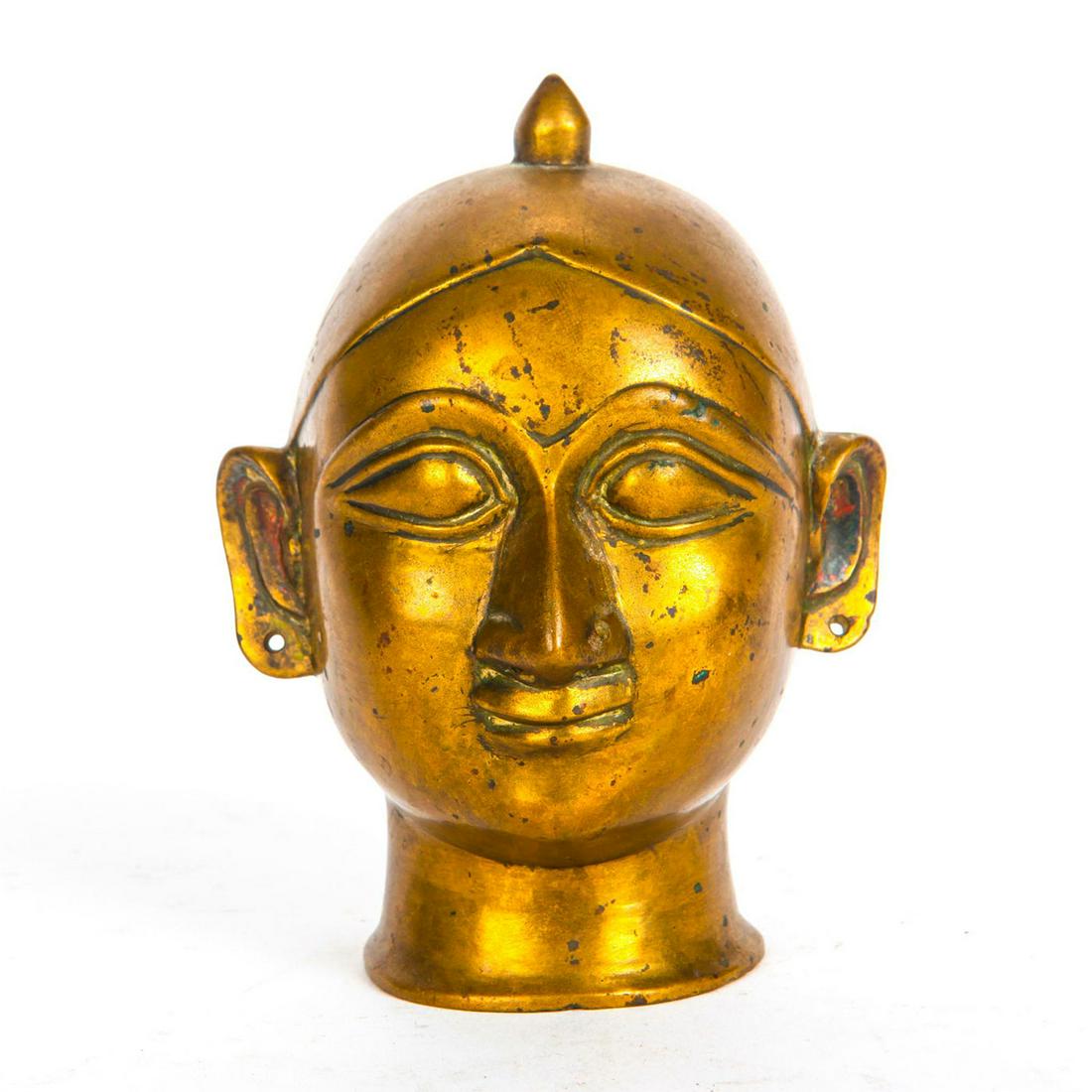 ANTIQUE BRASS TEMPLE ALTAR ORNAMENT, HEAD OF PARVATI: India. Hand cast representation of Hindu goddess of love and marriage. A 19th century Indian temple altar decoration modeled as Parvati Gauri, the Hindu goddess of fertility, love, beauty, marriage, c