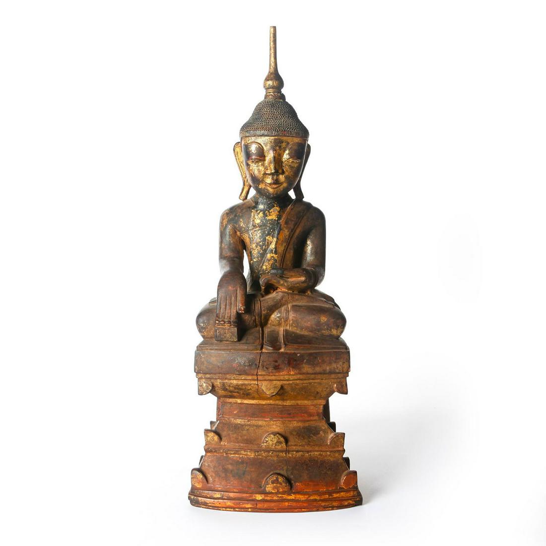 LATE SHAN PERIOD BURMESE WOODEN BUDDHA LACQUER GILT: Late 18th century. Applied gilding throughout. Approx. wt. 12 lb. Exquisite 18th century Shan Burmese Buddha, lacquered and gilt, depicted with an immensely serene expression and seated upon a raised