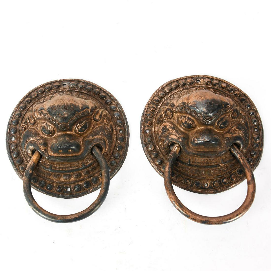 2 RARE TIBETAN LARGE DOOR KNOCKERS, LION HEADS: Allegorical motifs, produced in Tibet. Total weight 5.5 lbs. Issued: 20th c. Dimensions: 11.5"H x 9.5"W Country of Origin: Tibet Provenance: Collection of John J. Lanzendorf