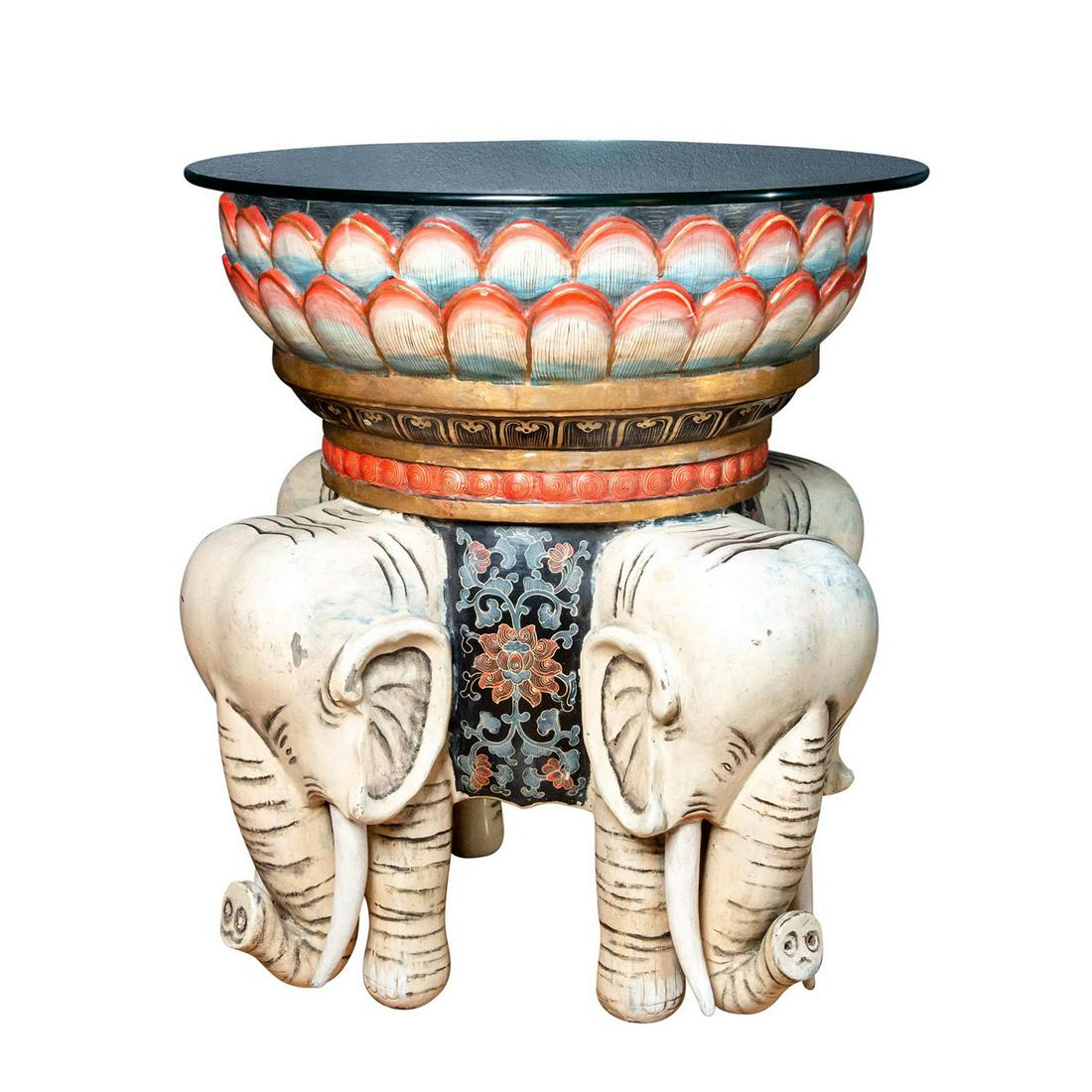 ALLEGORICAL CHINESE POLYCHROME WOODEN ELEPHANT TABLE: Figural base, 4 tusked elephants. Circular top, lotus petal skirt. An exquisite early Art Deco era Chinese polychrome painted wooden table, with gilt, red, and black lacquer over a circular top, and l
