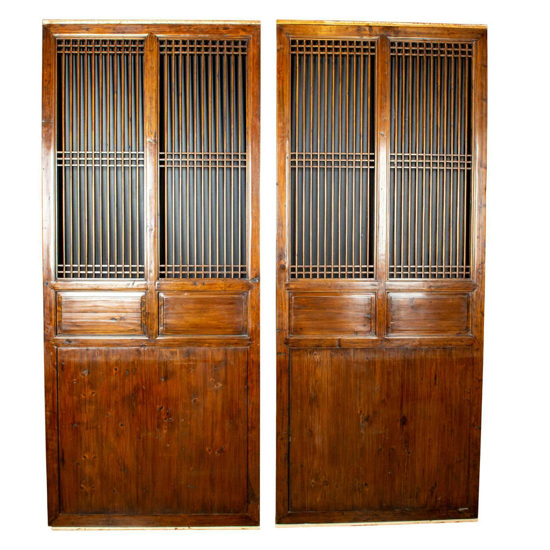 2 CHINESE OXBLOOD TRADITIONAL LARGE DOORS: Over 7 feet of hard wood hand carved Chinese doors. Issued: 1800 c. Dimensions: 90"H x 37"W Country of Origin: China Provenance: Collection of John J. Lanzendorf
