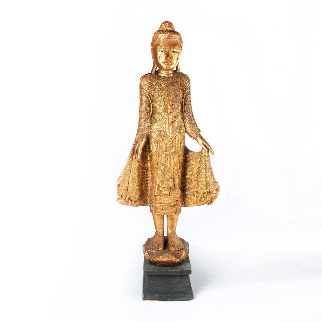 LARGE WOODEN SOUTH ASIAN GOLDEN BUDDHA: Hand crafted, decorated with small mirrors and in robe. Previous damage to neck. Issued: 20th c. Dimensions: 40"H Provenance: David Farin Collection
