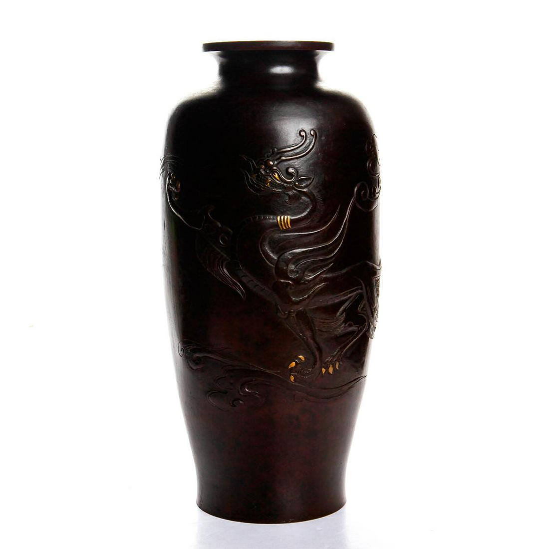 JAPANESE EARLY MEIJI PERIOD SIGNED BRONZE VASE: A tall and finely detailed early Meiji period mixed metal vase. This low relief bronze vase is decorated with a low relief stylized fire dragon and enhanced with gold inlays. Dimensions: 12"H x 5"D Co