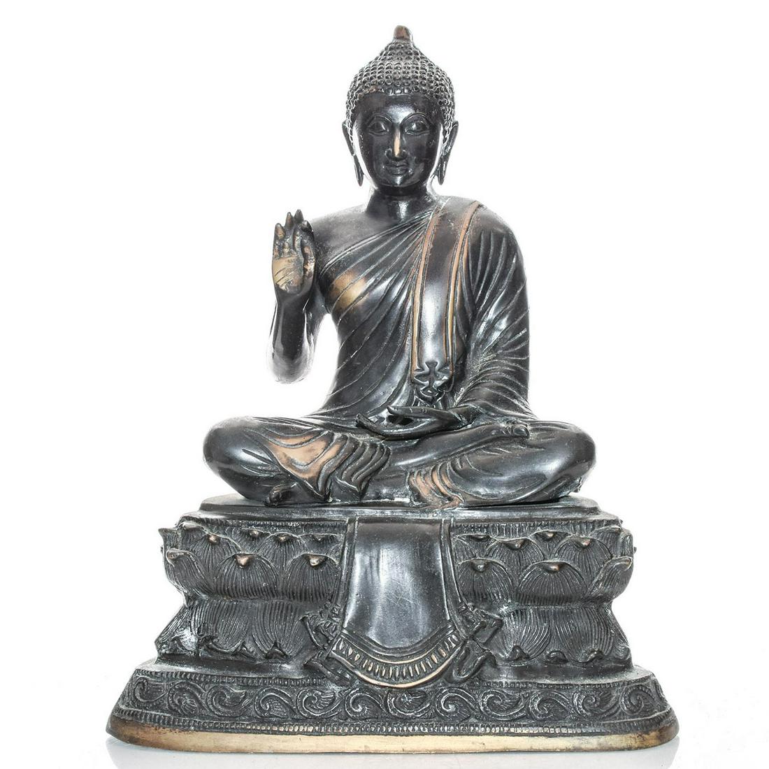 LARGE HINDU EASTERN ALLEGORICAL BRONZE BUDDHA STATUE: Dark metal with gilt highlights. Modeled as meditating Gautama Buddha. Issued: c. 1980 Dimensions: 15"H x 12"W Country of Origin: Indonesia Provenance: David Farin Collection