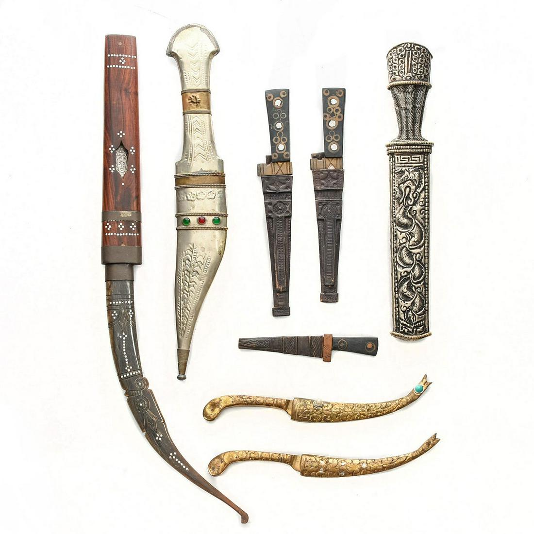 8 INDIAN OR NEPALESE KNIVES: Each with elaborate design, one with water buffalo horn handle. Issued: Mid 20th c. Dimensions: 15"L, longest Provenance: David Farin Collection