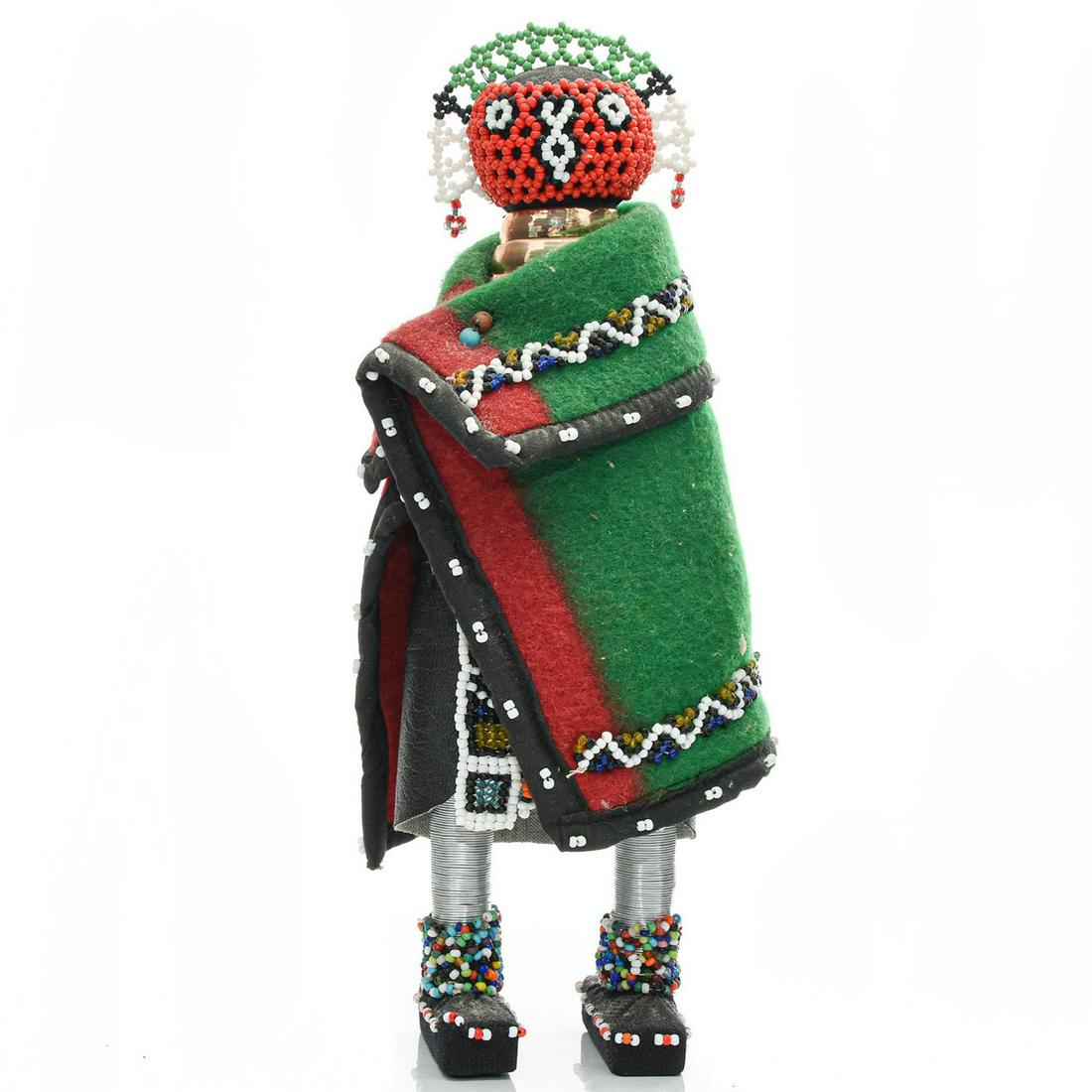 AFRICAN WOMAN DOLL WITH BEADED DECORATION: Cloaked in African colors with neck rings. Issued: 20th c. Dimensions: 12"H Provenance: David Farin Collection