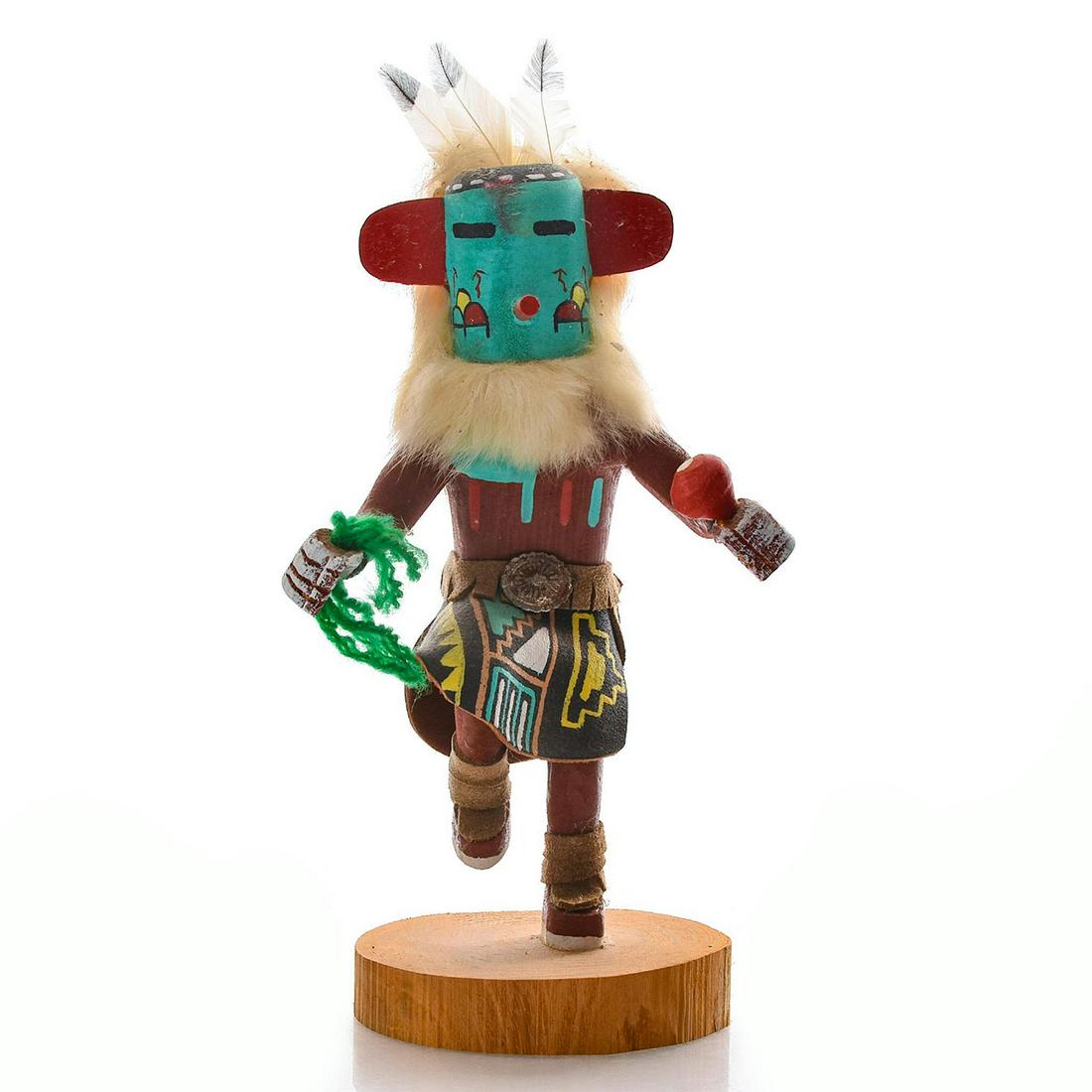 NATIVE AMERICAN HOPI KACHINA DOLL, MORNING SINGER: Dancer figure; carved from cottonwood; wears feathered headdress. Signed by artist and titled on base. The Morning Singer appears in the Bean dance and announces news. He sings songs to wake the villa
