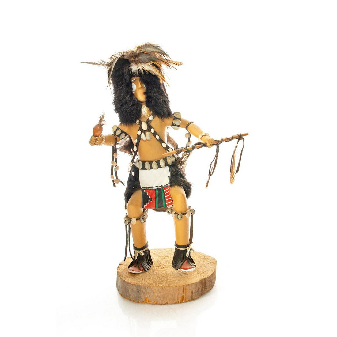 LARGE NATIVE AMERICAN TRIBAL STATUE, SPEAR DANCER: Wood, clay, shell, fabric in likeness of a Native tribal dancer. Hand made with wooden base and highly detailed. Fur, leather, shells, feathers, and other decorative highlights. Artist signed to base 