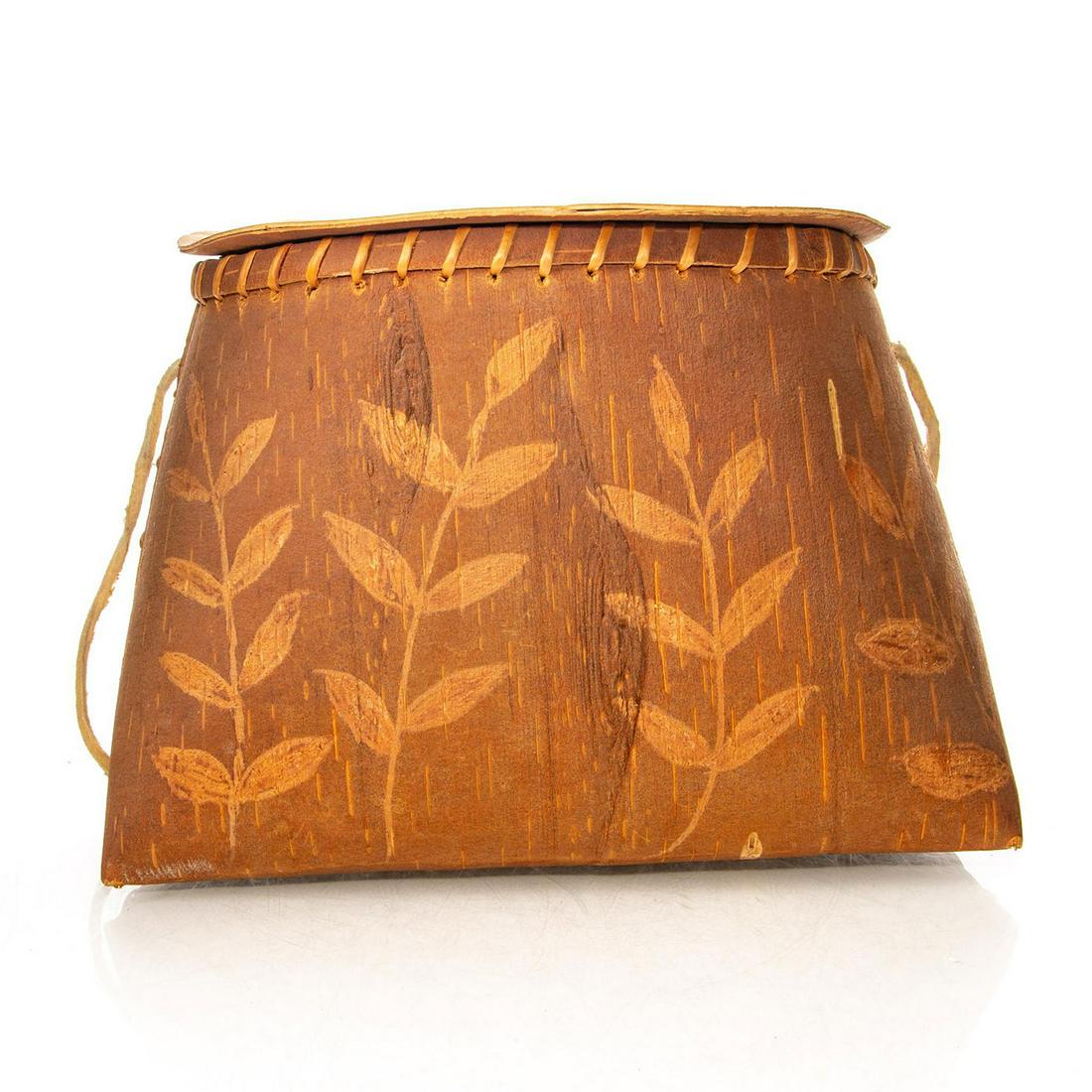 NATIVE AMERICAN PENOBSCOT ETCHED BIRCHBARK BASKET & LID: Traditional Native mukak container, extensive flora to body, lid. An exemplary Penobscot birchbark mukak basket container, sewn together with spruce root, and featuring a hide strap. The floral and le