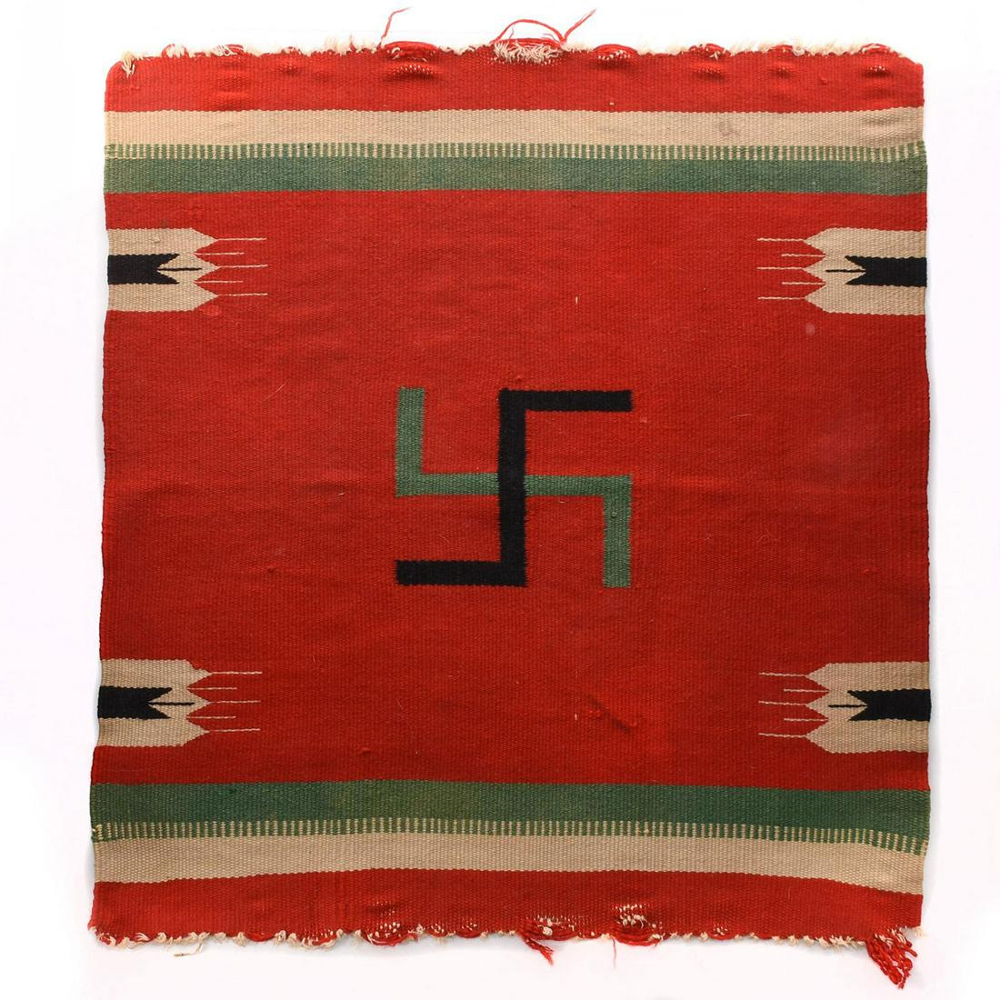 NATIVE AMERICAN NAVAJO CARPET RUG, WHIRLING LOGS WITH: Rare early 20th century tribal artifact with good luck symbol. This is a rare antique Native American Navajo blanket rug, produced c. 1910 with a prominent central traditional tribal Whirling Logs des