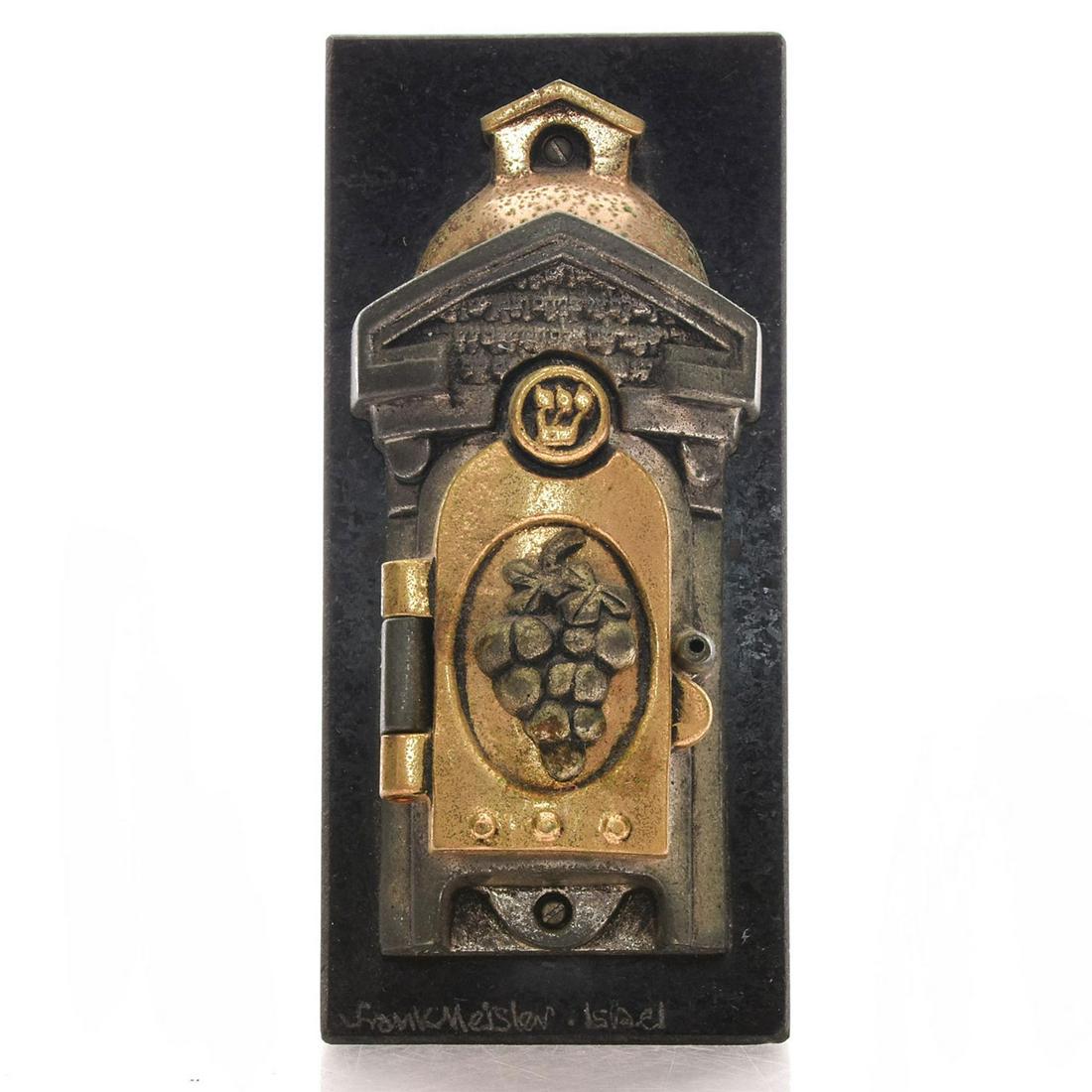 FRANK MEISNER MEZUZAH CASE: Two tone metal with patina, mounted on stone base. Artist: Frank Meisner Issued: Late 20th - Early 21st c. Dimensions: 5.75"H Country of Origin: Israel Provenance: David Farin Collection
