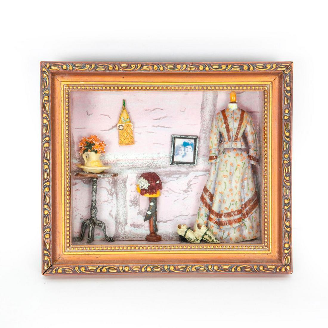 COLLECTABLE DIORAMA OF VICTORIAN DRESS: Collectable shadow box Diorama of woman's Victorian dress and doll house parlor furniture and accessories Dimensions: 10" x 8.5" framed Country of Origin: US