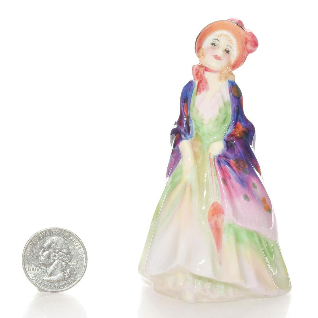 PAISLEY SHAWL M4 - ROYAL DOULTON MINI FIGURINE: Designed and hand painted by Leslie Harradine. Purple and green coloration. Handpainted title and M number. Michael Doulton signature to bottom base. Royal Doulton backstamp. Artist: Leslie Harradine 