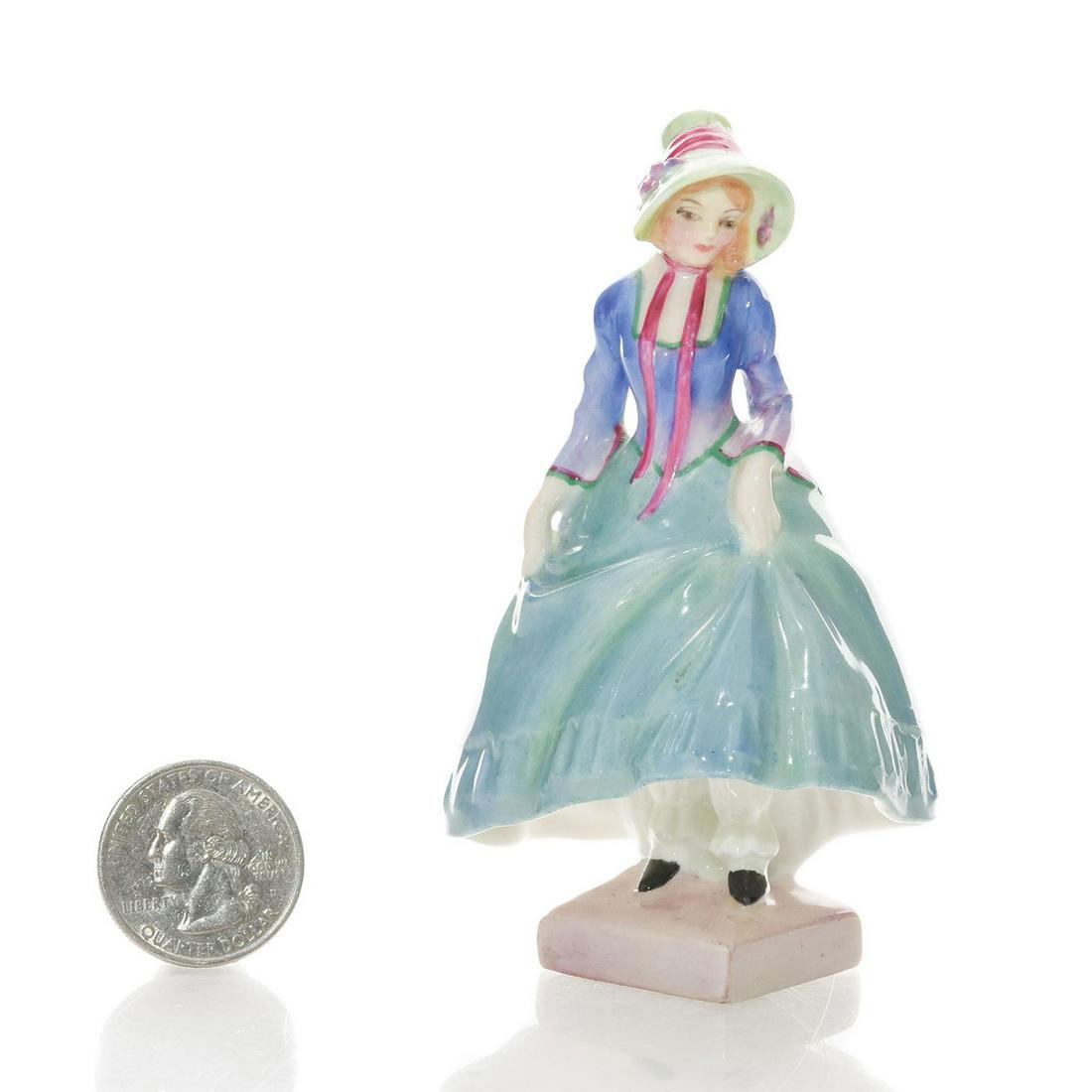 PANTALETTES M31 - ROYAL DOULTON MINI FIGURINE: Designed and hand painted by Leslie Harradine. Green and blue coloration. Handpainted title and M number. Royal Doulton backstamp. Artist: Leslie Harradine Issued: 1932 - 1945 Dimensions: 4"H Manufact