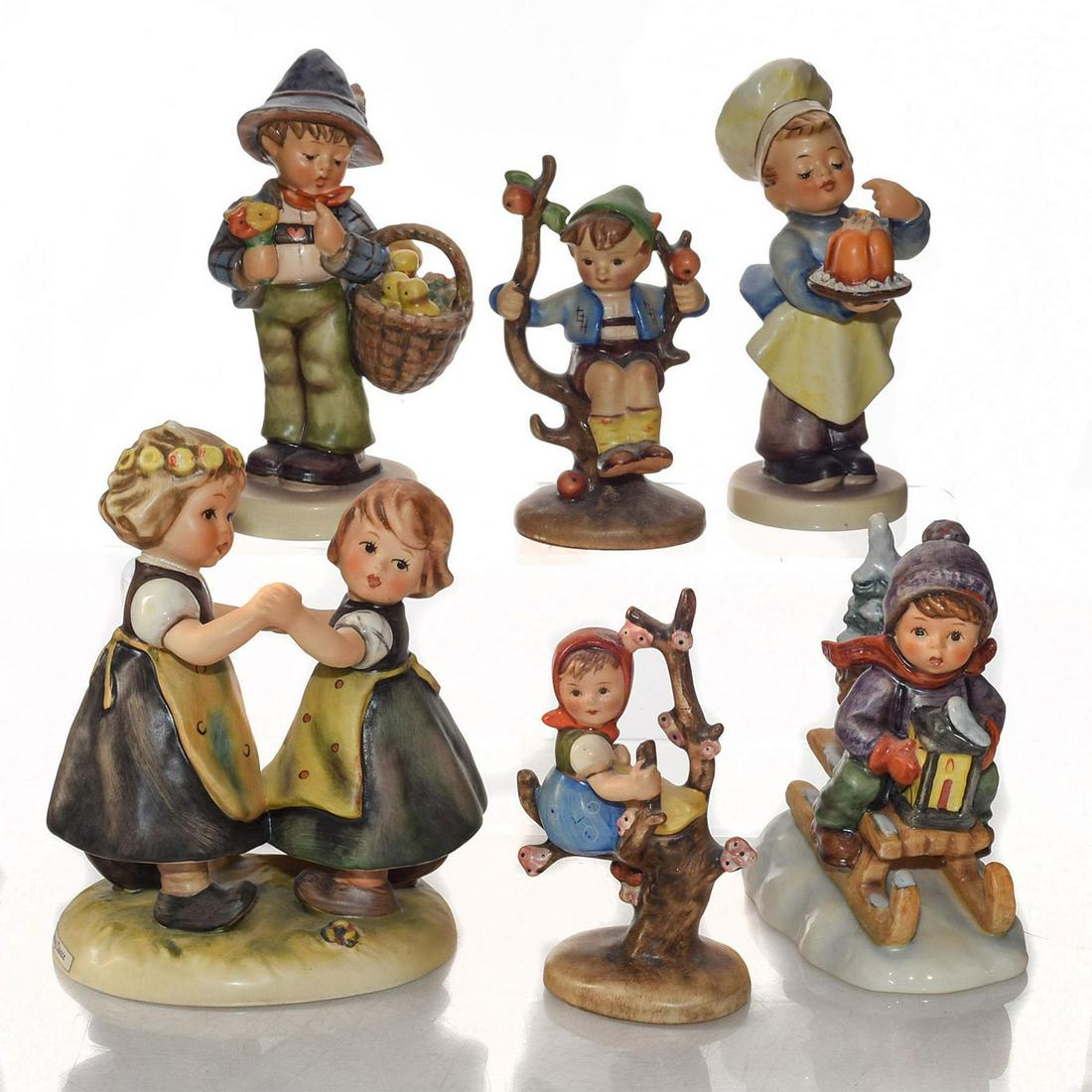 6 GOEBEL HUMMEL GERMAN FIGURINES: Includes Baker, Spring Dance, Easter, Ride Into Christmas. Goebel backstamps. Issued: 20th c. Dimensions: 5.5"H, tallest Manufacturer: Goebel Country of Origin: W. Germany