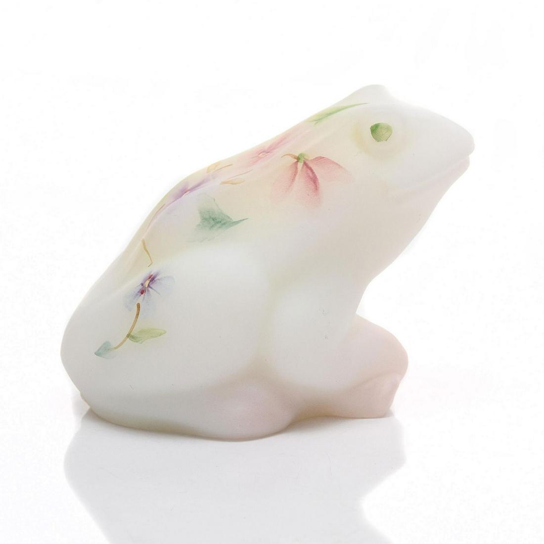 FENTON BURMESE GLASS FIGURE, FROG: Satin Burmese glass frog, hand painted flowers on back. Fenton logo and artist P. Hyland signature on the bottom. Issued: 20th c. Dimensions: 2.5"H Manufacturer: Fenton Art Glass Co. Country of Origin