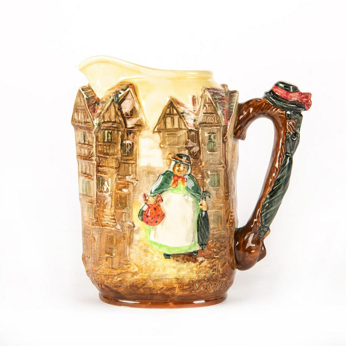 ROYAL DOULTON SERIESWARE SAIREY GAMP RELIEF JUG D6395: Features Sairey Gamp from Martin Chuzzelwit by Charles Dickens. High relief. Handle is modelled as a hat and umbrella. Royal Doulton backstamp. Issued: c. 1930 Dimensions: 6.75"H Manufacturer: Royal D