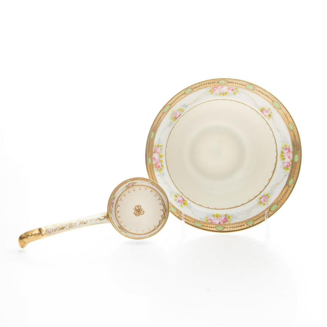 HAND PAINTED NIPPON LADLE AND BOWL: Floral, gilt design. Stamped hand painted Nippon to bottom. Edwardian style, with fine accents. Issued: 20th c. Dimensions: 6"D x 2"H, bowl Manufacturer: Nippon Country of Origin: Japan