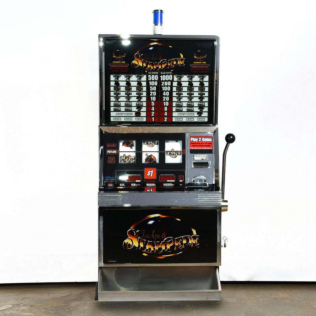 CLASSIC WILLIAMS $1 SLOT MACHINE, JACKPOT STAMPEDE: Accepts quarters or dollar bills. Includes key. Unique accent piece for the casino, games, or Vegas collector. Machine powers on, lever pulls and reels spin. Not tested for full functionality. Issued: