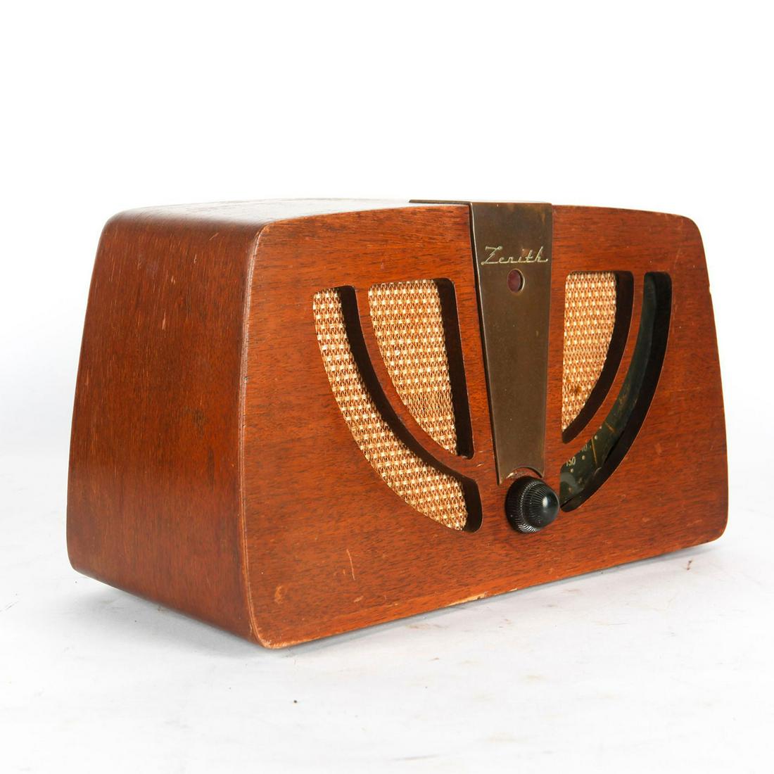 VINTAGE ART DECO ZENITH WOODEN GOLDEN AGE TABLE RADIO: Model 6D030. Brass and Bakelite fixtures. Original dial display. Issued: c. 1946 Dimensions: 7.5"H x 13.75"L Manufacturer: Zenith Radio Corporation Country of Origin: United States