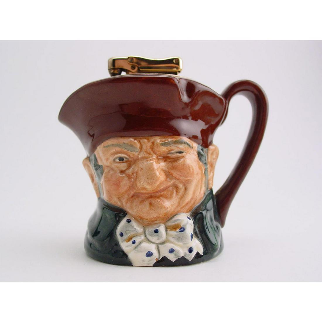 OLD CHARLEY D5227 - LIGHTER - ROYAL DOULTON: Royal Doulton Lighter, Old Charley Lighter; D5227 (brown hat; dark green coat; blue polka-dot bow tie). Designed by Charles Noke, issued 1959 -1973. Size: 3.5"HTen o'clock and all's well was the famil