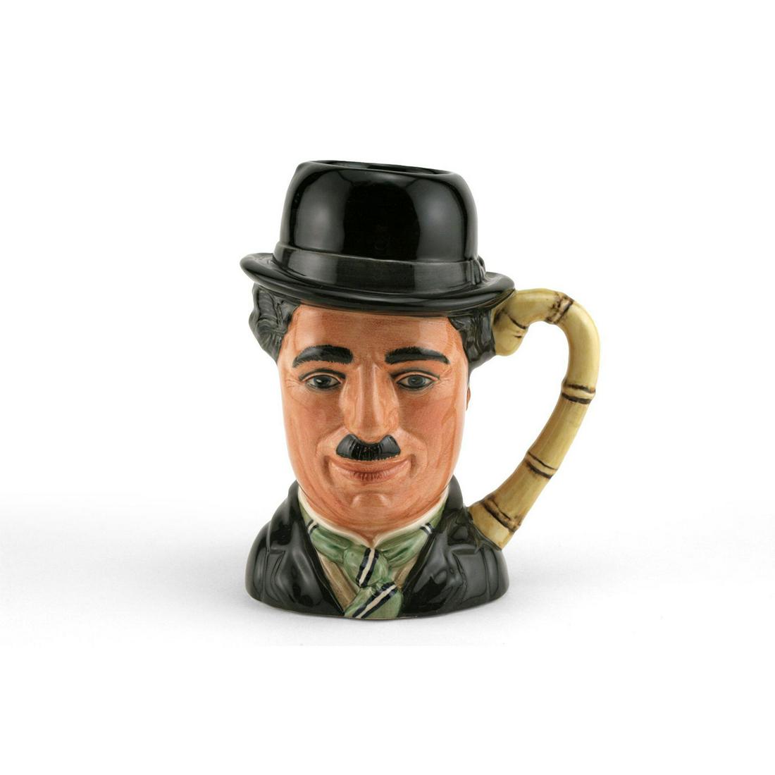 CHARLIE CHAPLIN D6949 - LARGE - ROYAL DOULTON CHARACTER: Royal Doulton Character Jug, Charlie Chaplin D6949 (black hat and jacket; green, white and black striped tie). Designed by William K. Harper, issued 1993 in limited edition of 5,000. Size 7.25"H (Larg