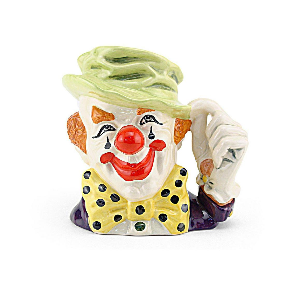 CLOWN D6834 - LARGE - ROYAL DOULTON CHARACTER JUG: Royal Doulton Character Jug, Clown D6834 (green cap, yellow bow tie with black spots, red nose and mouth). Designed by Stanley J. Taylor. Series: The Circus Performers, issued 1989 - 1995. Size 6.5"H 