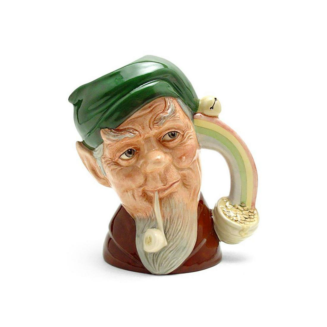 LEPRECHAUN D6899 - SMALL - ROYAL DOULTON CHARACTER JUG: Royal Doulton Character Jug, Leprechaun D6899 (green cap; brown coat). Designed by William K. Harper, issued 1991 - 1996. Size: 4.5"H (Small)The wizened little elf is a legendary Irish sprite with a m