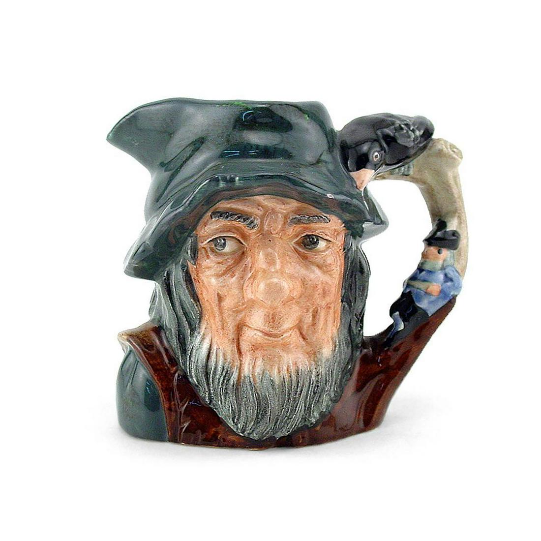 RIP VAN WINKLE D6463 - SMALL - ROYAL DOULTON CHARACTER: Rip Van Winkle D6463 (grey-blue cap; brown robes; figure dressed in blue resting against a tree). Designed by Geoff Blower. Series: Characters from Literature, issued 1957 - 1995. Size: 4"H (Small) In