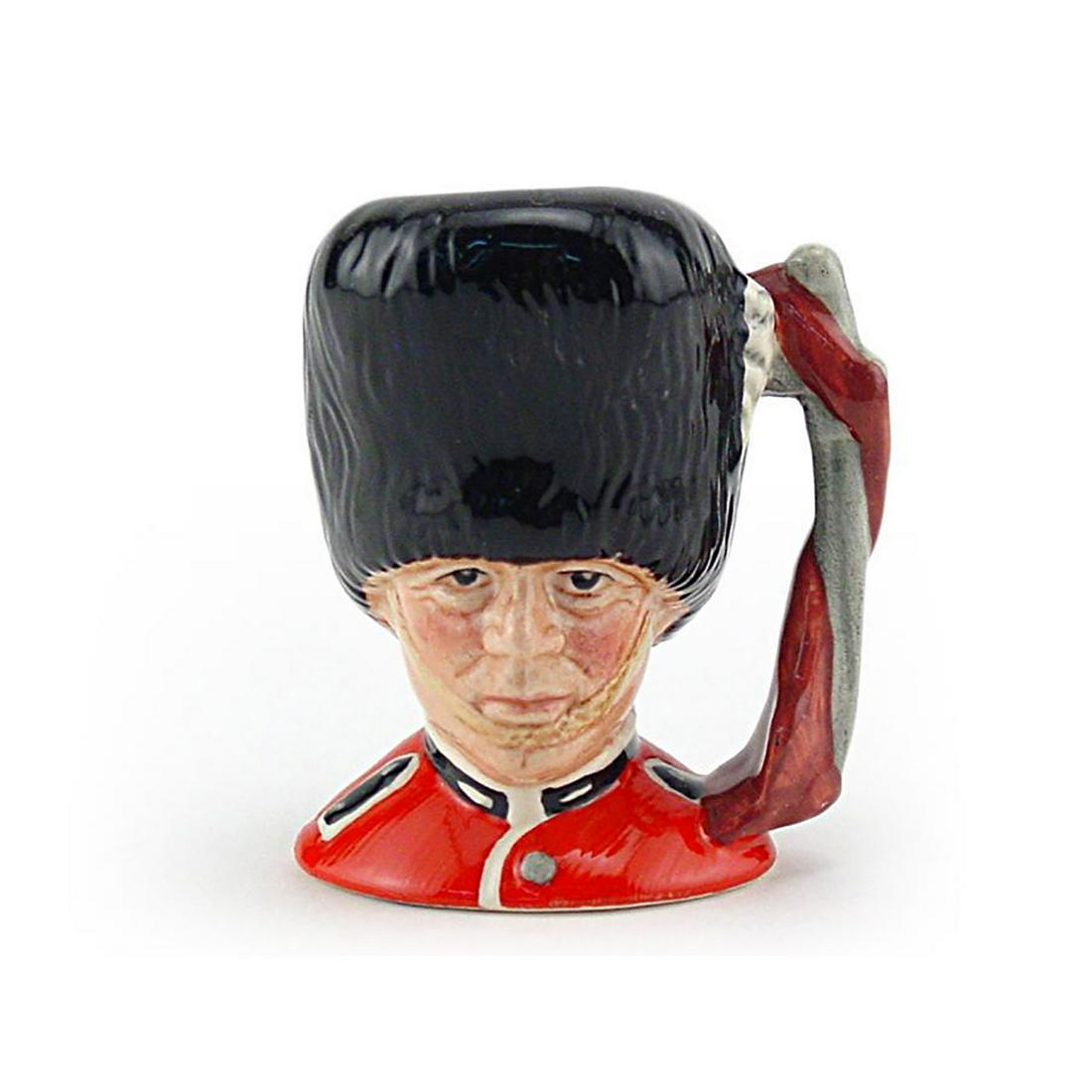 GUARDSMAN D6772 - MINI - ROYAL DOULTON CHARACTER JUG: Royal Doulton Character Jug, Guardsman D6772 (red tunic; black bearskin hat). Designed by Stanley J. Taylor. Series: The London Collection, issued 1987 - 1991. Size: 2.5"H (mini)Long a fixture in Lond