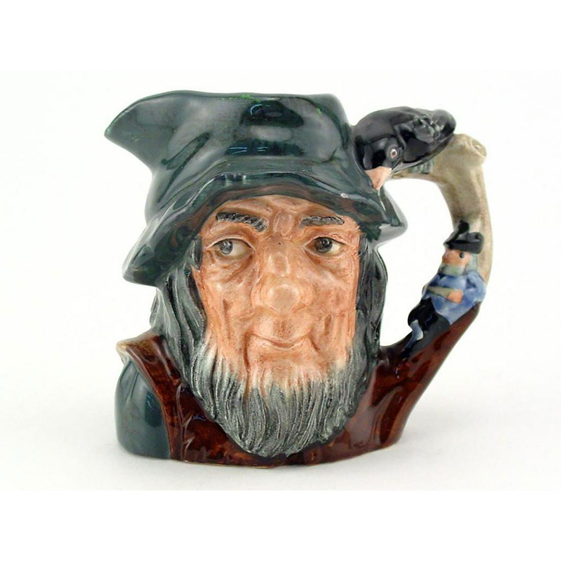 RIP VAN WINKLE D6517 - MINI - ROYAL DOULTON CHARACTER: Royal Doulton Character Jug, Rip Van Winkle D6517 (grey-blue cap; brown robes; figure dressed in blue resting against tree). Designed by Geoff Blower. Series: Characters from Literature, issued 1960 -