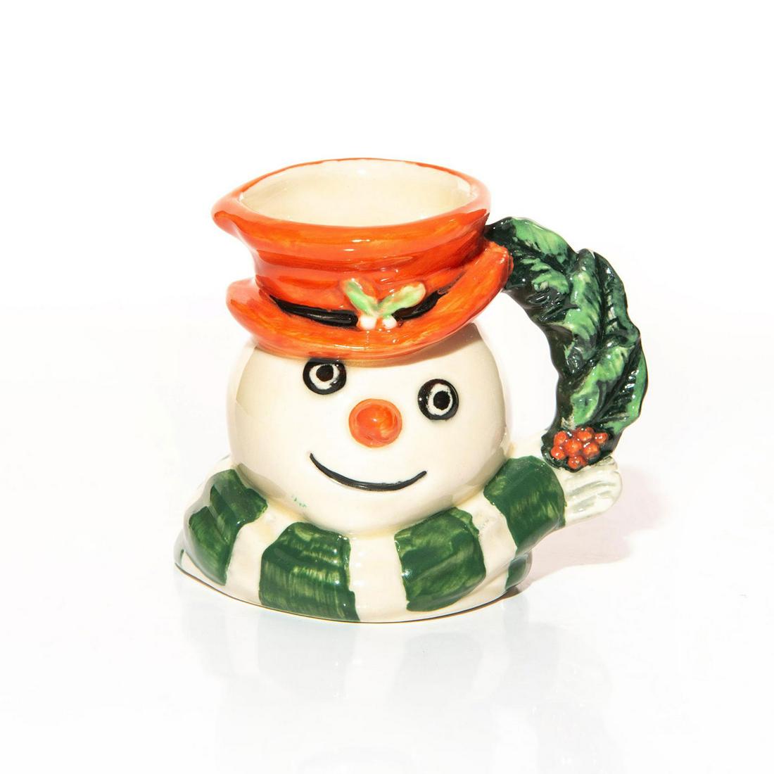 SNOWMAN D7062 - MINI - ROYAL DOULTON CHARACTER JUG: Mini character jug of smiling snowman with red hat and scarf. Issued: 1997 Dimensions: 3"H Manufacturer: Royal Doulton Country of Origin: England