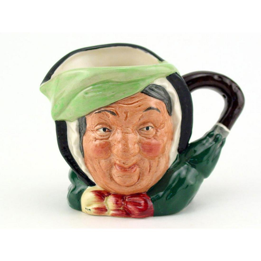 SAIREY GAMP D6045 - MINI - ROYAL DOULTON CHARACTER JUG: Royal Doulton Character Jug, Sairey Gamp D6045 (black hair; light green band; dark green coat; yellow and burgundy bow). Designed by Leslie Harradine and Harry Fenton. Series: Charles Dickens' Charact