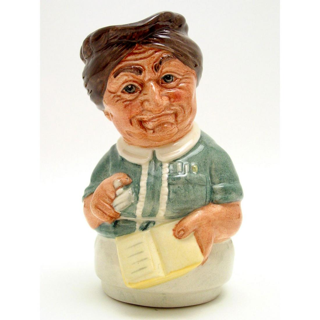 MRS. LOAN THE LIBRARIAN D6715 - ROYAL DOULTON TOBY JUG: Royal Doulton Toby Jug, Mrs. Loan the Librarian D6715 (dark green blouse trimmed with white; light green skirt; yellow book). Designed by William K. Harper. Series: The Doultonville Collection, issued