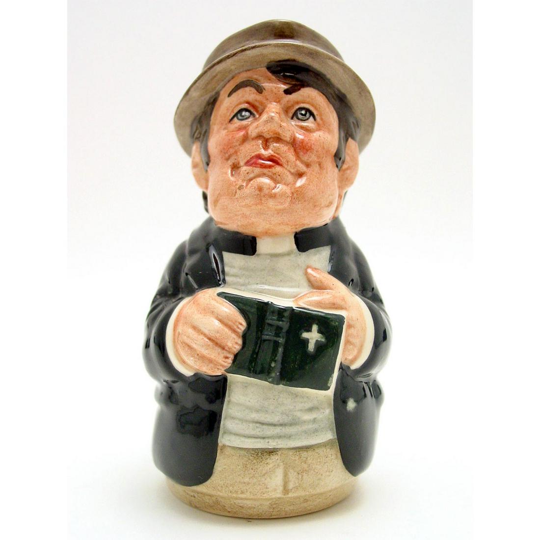 REV. CASSOCK THE CLERGYMAN D6702 - ROYAL DOULTON TOBY: Royal Doulton Toby Jug, Rev. Cassock the Clergyman D6702 (black coat; grey shirt; brown cap). Designed by William K. Harper. Series: The Doultonville Collection, issued 1983 - 1990. Size: 4''H (small)