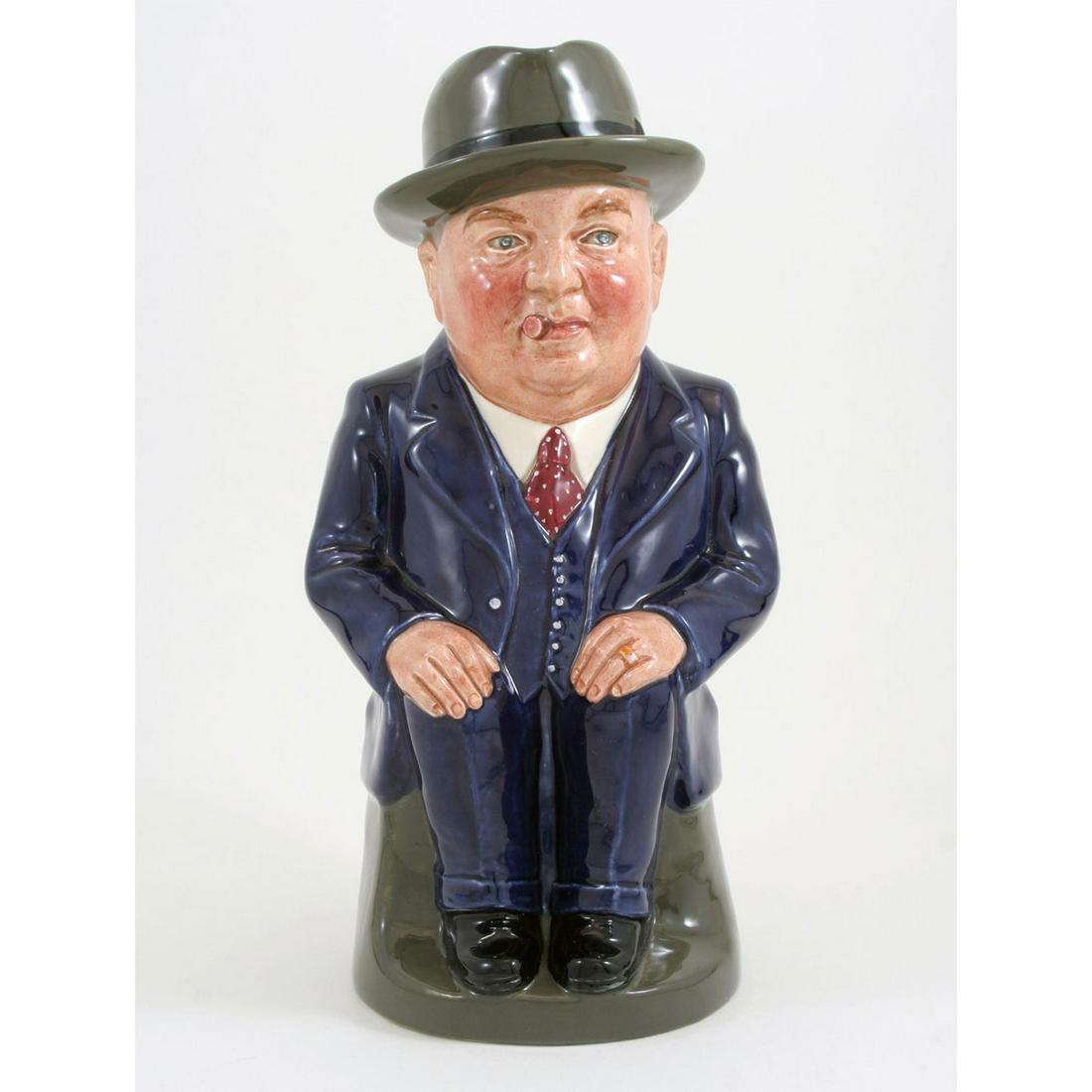 CLIFF CORNELL (DARK BLUE SUIT, LARGE) - ROYAL DOULTON: Royal Doulton Toby Jug, Cliff Cornell Large (Dark Blue Suit; red tie with cream polka dots). Designed by Unknown, issued 1956 - 1956. Size: 9''H (large) Through the years, Royal Doulton has interprete