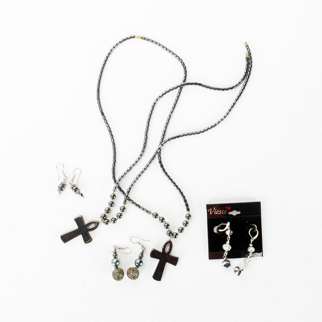 HEMATITE SILVER JEWELRY WITH 2 NECKLACES: Ankh crosses on 2 necklaces, and 3 earrings. Total weight 123g. necklace size 24". Issued: 20th c. Dimensions: Total weight 123g.