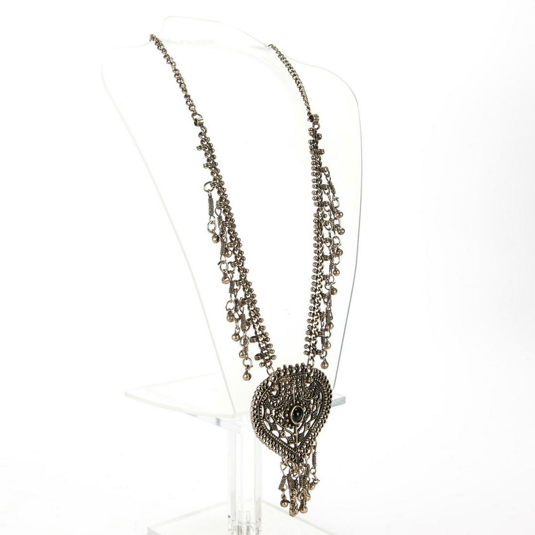 INDIAN SILVER PENDANT NECKLACE: Reticulated, geometric design w. inset black stone to center. Oxidation/patina consistent with age. Total weight is approximately 135.6g. Issued: 20th c. Dimensions: 24"L