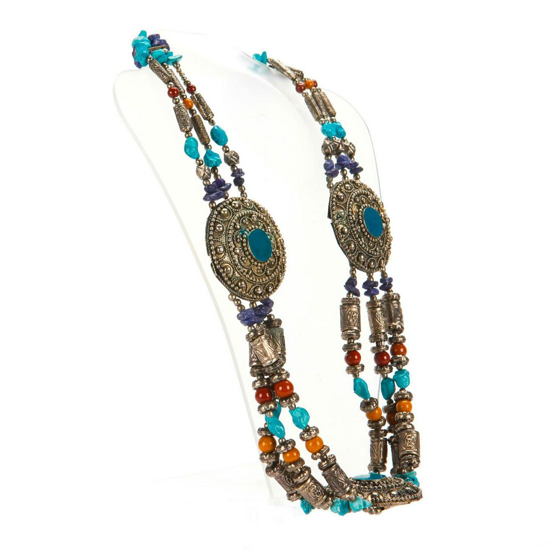 LARGE 20TH C. ASIAN SILVER AND STONE NECKLACE: Silver beads, ornaments, with raw turquoise, lapis, other stones. Oxidation/patina consistent with age. Total weight is approximately 205.7g. Issued: 20th c. Dimensions: 30"L