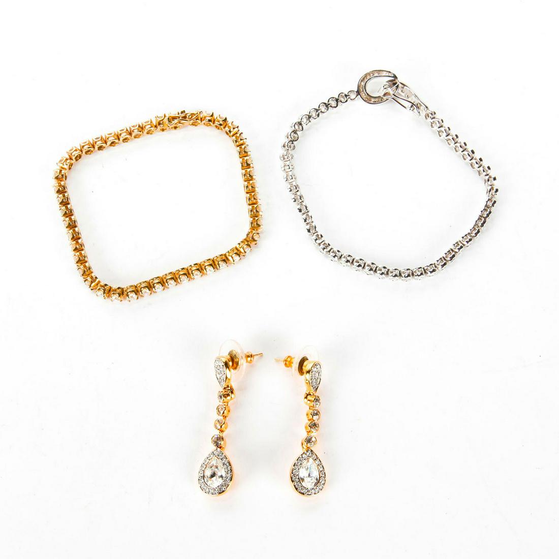 2 TENNIS BRACELETS, 1 PAIR SWAROVSKI CRYSTAL EARRINGS: Bracelets in sterling silver, gold vermeil. Each stamped 925. Total weight is approximately 25g. Issued: Late 20th - Early 21st c. Dimensions: 7"C, each bracelet